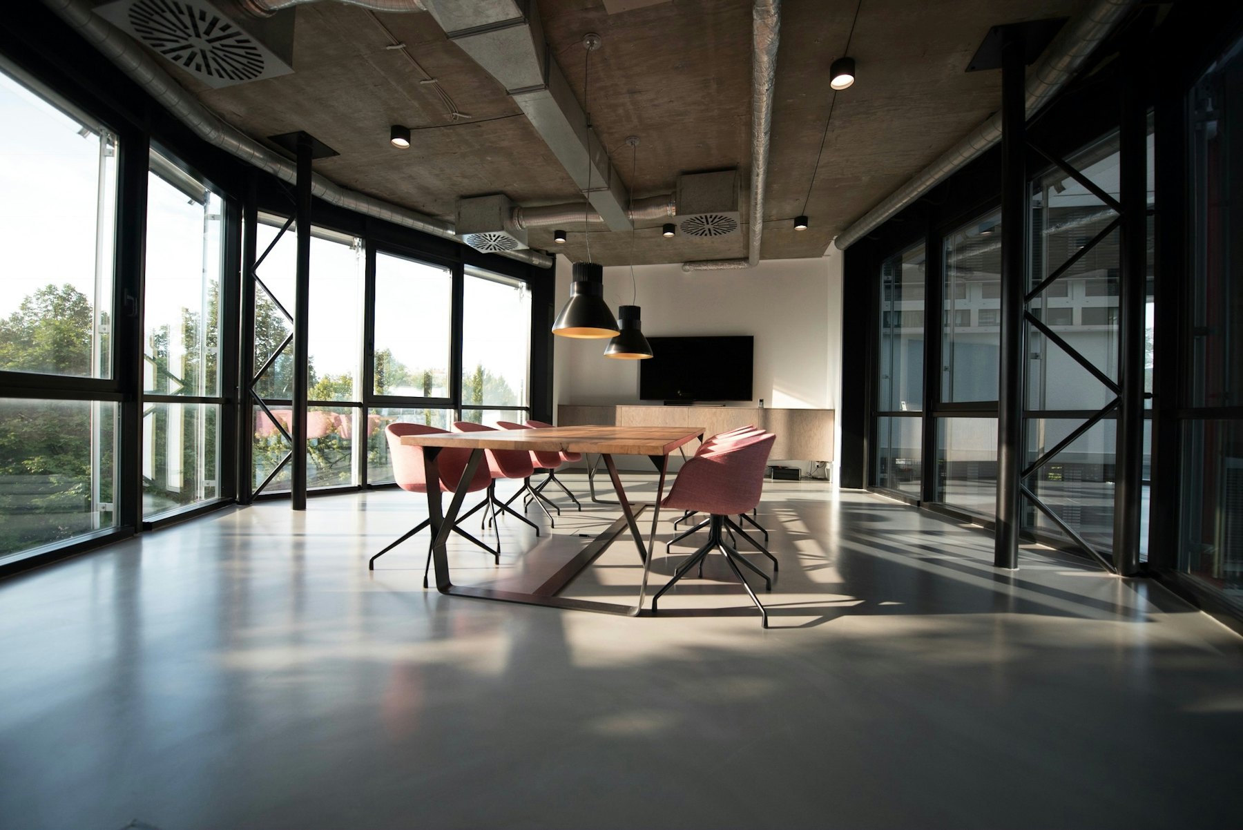 Open modern office lounge with large windows